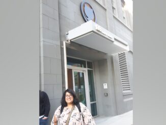 Murrium standing outside Github headquarters.|Murrium standing outside Github headquarters|Murrium's team mates sitting at a table. From left to right; Warren; Brian; Tia; Perry.|People waiting in line to start the Hackathon||FreeCodeCamp Hackathon competitors working on their projects|Gabriel Greenfield of the winning team|Gabriel Greenfield of the winning team