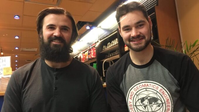 Photograph of Riley Smith and Justin Collett.|Sponsors for the National Geomatics Competition