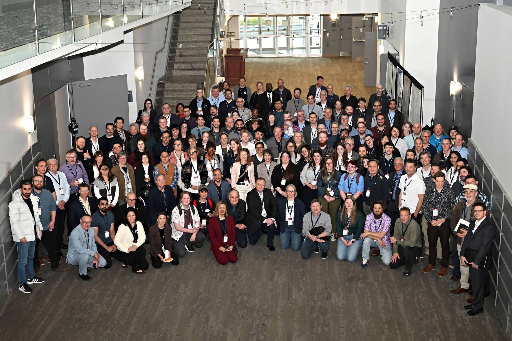 The GeoIgnite 2026 community gathers for an official group photo in the Ottawa Conference and Event Centre atrium.
